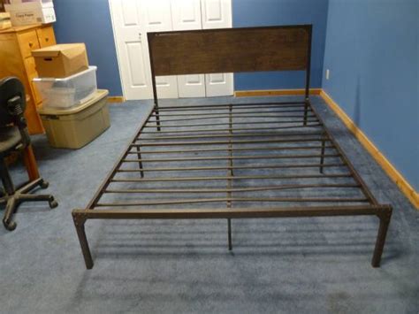 Bed frame with 2 night stands. . Craigslist queen bed frame